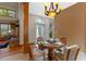 Bright breakfast nook with chandelier and seamless view of living room at 1417 Olympia Ave, Mount Dora, FL 32757