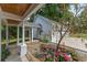Covered walkway, garden, and a three-car garage at 1417 Olympia Ave, Mount Dora, FL 32757