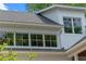 A view of the home's exterior showcasing windows and architectural details at 1417 Olympia Ave, Mount Dora, FL 32757