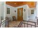 Inviting front porch featuring brick floor, wood ceiling, and cozy seating area at 1417 Olympia Ave, Mount Dora, FL 32757