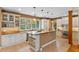 Bright kitchen featuring granite countertops, a spacious island, and modern appliances at 1417 Olympia Ave, Mount Dora, FL 32757
