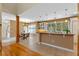 Open kitchen featuring breakfast nook, granite counters, and view of staircase at 1417 Olympia Ave, Mount Dora, FL 32757
