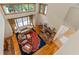 Living room with stone fireplace, hardwood floors, furniture and large windows at 1417 Olympia Ave, Mount Dora, FL 32757