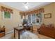 Cozy home office with natural light and neutral tones at 1417 Olympia Ave, Mount Dora, FL 32757