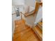 Beautiful staircase with hardwood steps and white risers at 1417 Olympia Ave, Mount Dora, FL 32757