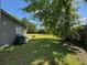 Lush backyard with mature trees and ample privacy at 1433 Kingston Ave, Orlando, FL 32807