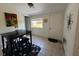 Dining room with black table set and window view at 1433 Kingston Ave, Orlando, FL 32807