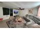 Cozy living room features plush seating, a ceiling fan, and a decorative rug at 1433 Kingston Ave, Orlando, FL 32807