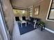 Inviting screened-in patio with comfortable seating and stylish decor at 1433 Kingston Ave, Orlando, FL 32807