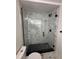 Bathroom featuring a glass enclosed shower with black hardware and decorative tile at 1538 Brookebridge Dr, Orlando, FL 32825