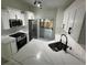 Modern kitchen with quartz countertops, stainless steel appliances, and sliding door to screened in porch at 1538 Brookebridge Dr, Orlando, FL 32825