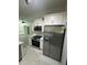 This modern kitchen features stainless steel appliances, quartz countertops and open floor plan at 1538 Brookebridge Dr, Orlando, FL 32825