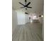 Bright living room featuring modern ceiling fan and view of the open concept kitchen at 1538 Brookebridge Dr, Orlando, FL 32825