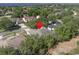 Aerial view of this home in its serene setting, surrounded by lush greenery and mature landscaping at 1551 Sherbrook Dr, Clermont, FL 34711