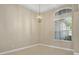 Dining area features a decorative chandelier and large window overlooking the front yard at 1551 Sherbrook Dr, Clermont, FL 34711