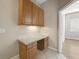 Convenient home office nook features granite countertops and ample storage, perfect for productivity at 1551 Sherbrook Dr, Clermont, FL 34711