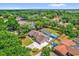 Spacious home with screened pool and a large backyard featuring a wooded surround at 1558 Regal Oak Dr, Kissimmee, FL 34744