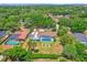 Aerial view showing pool, fenced backyard, and landscaping in a serene neighborhood at 1558 Regal Oak Dr, Kissimmee, FL 34744