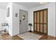 Entryway features stylish front door, decorative rug, and a conveniently located closet at 1558 Regal Oak Dr, Kissimmee, FL 34744