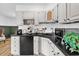 Functional kitchenette features dark countertops, white cabinets, and is equipped with a mini fridge at 1558 Regal Oak Dr, Kissimmee, FL 34744