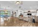 Spacious living room features a cozy fireplace, hardwood floors, and lots of natural light at 1558 Regal Oak Dr, Kissimmee, FL 34744