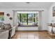 Living area with oversized windows that offer a relaxing view of the front yard at 1558 Regal Oak Dr, Kissimmee, FL 34744