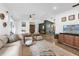 Comfortable living room featuring hardwood floors and open access to dining area at 1558 Regal Oak Dr, Kissimmee, FL 34744