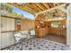 Charming outdoor patio featuring unique star-patterned tile, a wood bar and seating at 1558 Regal Oak Dr, Kissimmee, FL 34744