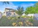 Manicured backyard with a large pool, screened enclosure, and lush landscaping for outdoor enjoyment at 16844 Rising Star Dr, Clermont, FL 34714