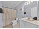 Clean bathroom featuring a neutral color scheme, a shower, and a vanity with decor at 16844 Rising Star Dr, Clermont, FL 34714