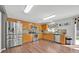 Bright kitchen features stainless steel appliances, granite counters, and wood flooring at 16844 Rising Star Dr, Clermont, FL 34714