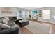 Cozy living room with comfortable seating and a serene entertainment setup at 16844 Rising Star Dr, Clermont, FL 34714