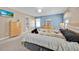 Primary bedroom with neutral walls, a queen-size bed, and matching dressers at 16844 Rising Star Dr, Clermont, FL 34714