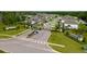 Aerial view of a residential community featuring houses, lawns, streets, and green spaces at 17309 Cagan Crossing Blvd, Clermont, FL 34714