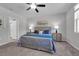 Calming bedroom with carpet, ceiling fan, a neutral color palette, and an ensuite bathroom at 17309 Cagan Crossing Blvd, Clermont, FL 34714