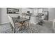 Elegant dining area adjacent to a modern kitchen, featuring a large table, and stylish seating at 17309 Cagan Crossing Blvd, Clermont, FL 34714