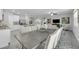 Open concept dining area featuring a large table and chairs adjacent to a modern kitchen at 17309 Cagan Crossing Blvd, Clermont, FL 34714