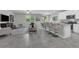 Open-concept living area with modern kitchen, cozy living room, and bright dining space at 17309 Cagan Crossing Blvd, Clermont, FL 34714