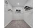Bright and airy walk-in closet with wire shelving, carpeted floors, and neutral paint colors at 17309 Cagan Crossing Blvd, Clermont, FL 34714