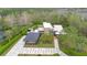 Stunning aerial view of modern home featuring solar panels and lush, manicured landscaping at 1766 Alaqua Dr, Longwood, FL 32779