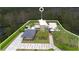 Aerial view of modern home with solar panels, lush landscaping, and basketball court at 1766 Alaqua Dr, Longwood, FL 32779