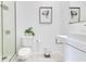 Modern white bathroom with glass enclosed shower, stylish sink, and plant accent at 1766 Alaqua Dr, Longwood, FL 32779