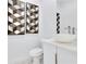 Modern powder room with vessel sink, decorative mirrors, and white finishes at 1766 Alaqua Dr, Longwood, FL 32779