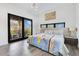 Bright bedroom featuring large windows and a private balcony at 1766 Alaqua Dr, Longwood, FL 32779
