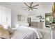 Modern bedroom design featuring white walls, tile flooring, and a convenient kitchenette at 1766 Alaqua Dr, Longwood, FL 32779