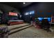 Dark themed bedroom with leopard carpet, desk, and gaming setup at 1766 Alaqua Dr, Longwood, FL 32779