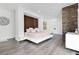 Modern bedroom showcasing wood paneling, platform bed, and recessed lighting, offering a serene retreat at 1766 Alaqua Dr, Longwood, FL 32779