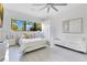 Bright bedroom with modern furnishings and a view of the outdoor scenery from a large window at 1766 Alaqua Dr, Longwood, FL 32779
