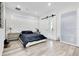 Sleek bedroom with platform bed, sliding barn door and modern finishes at 1766 Alaqua Dr, Longwood, FL 32779
