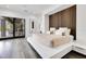 Modern bedroom showcasing wood paneling, platform bed, and recessed lighting, offering a serene retreat at 1766 Alaqua Dr, Longwood, FL 32779